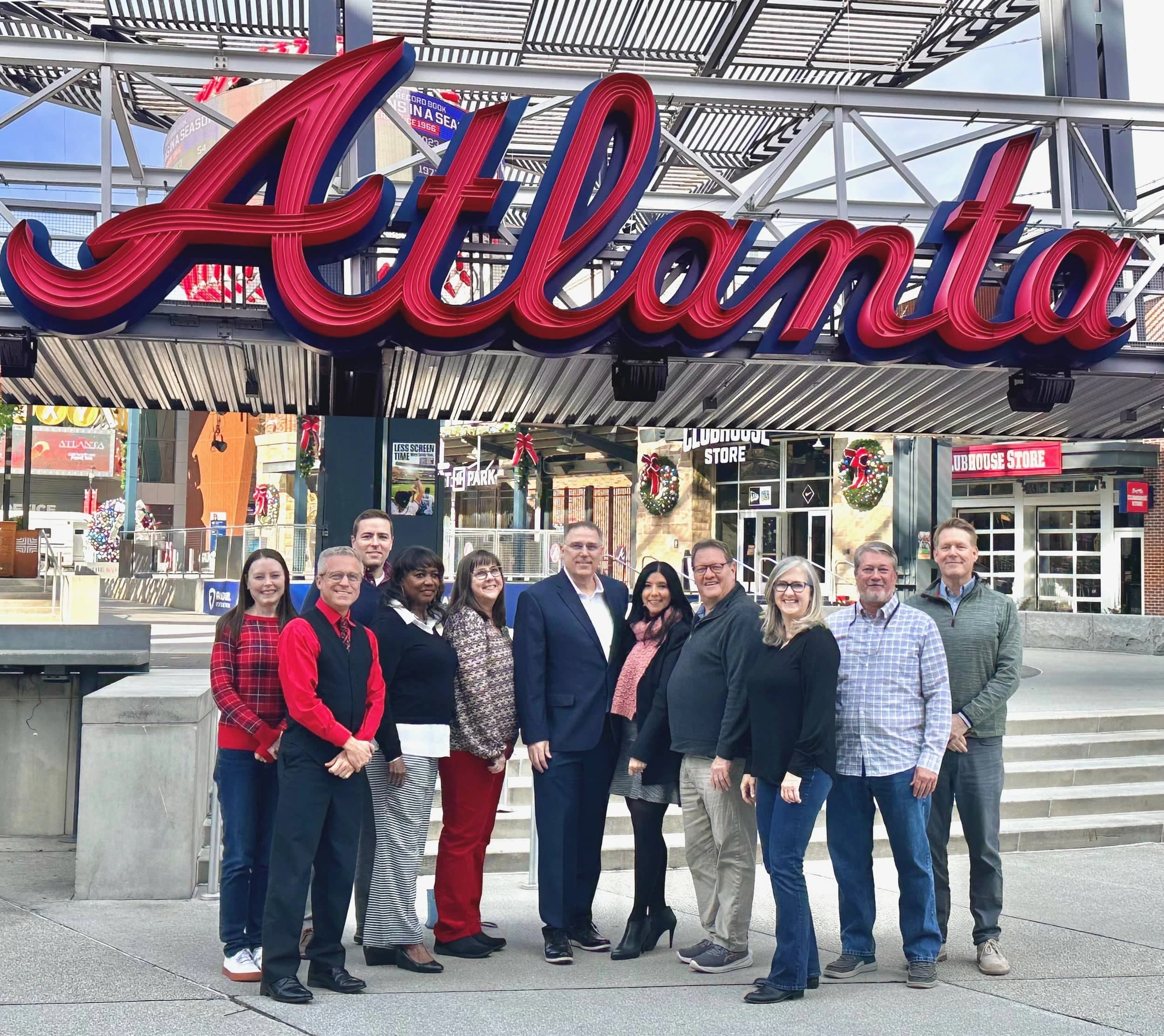 NürnbergMesse North America team in front of Atlanta sign